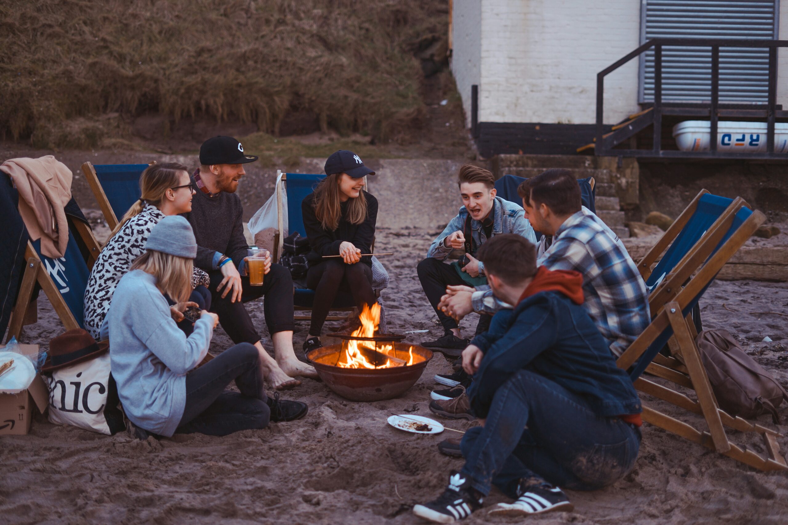 a group of people talking and having a good time.