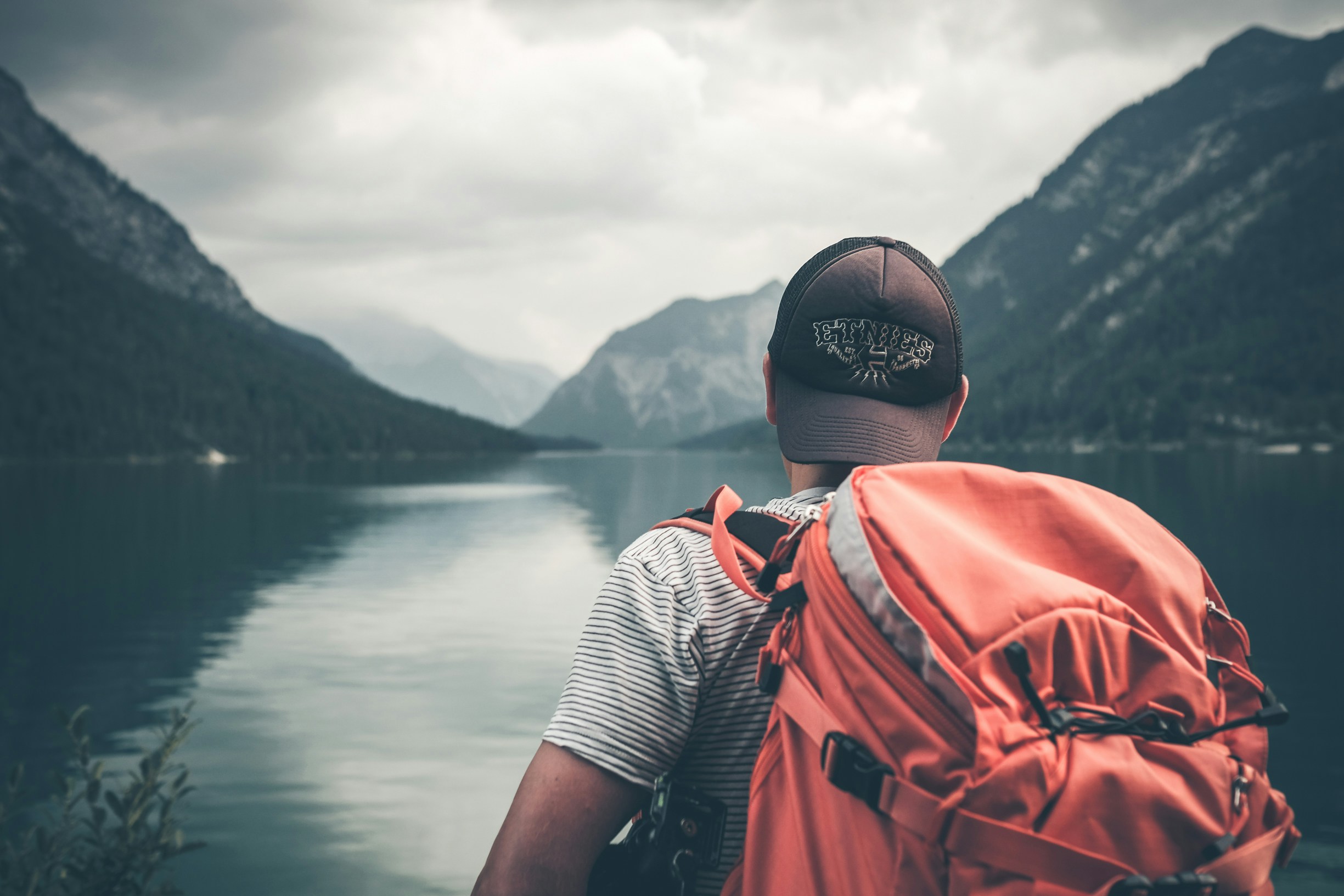 a guy is traveling with his backpack
